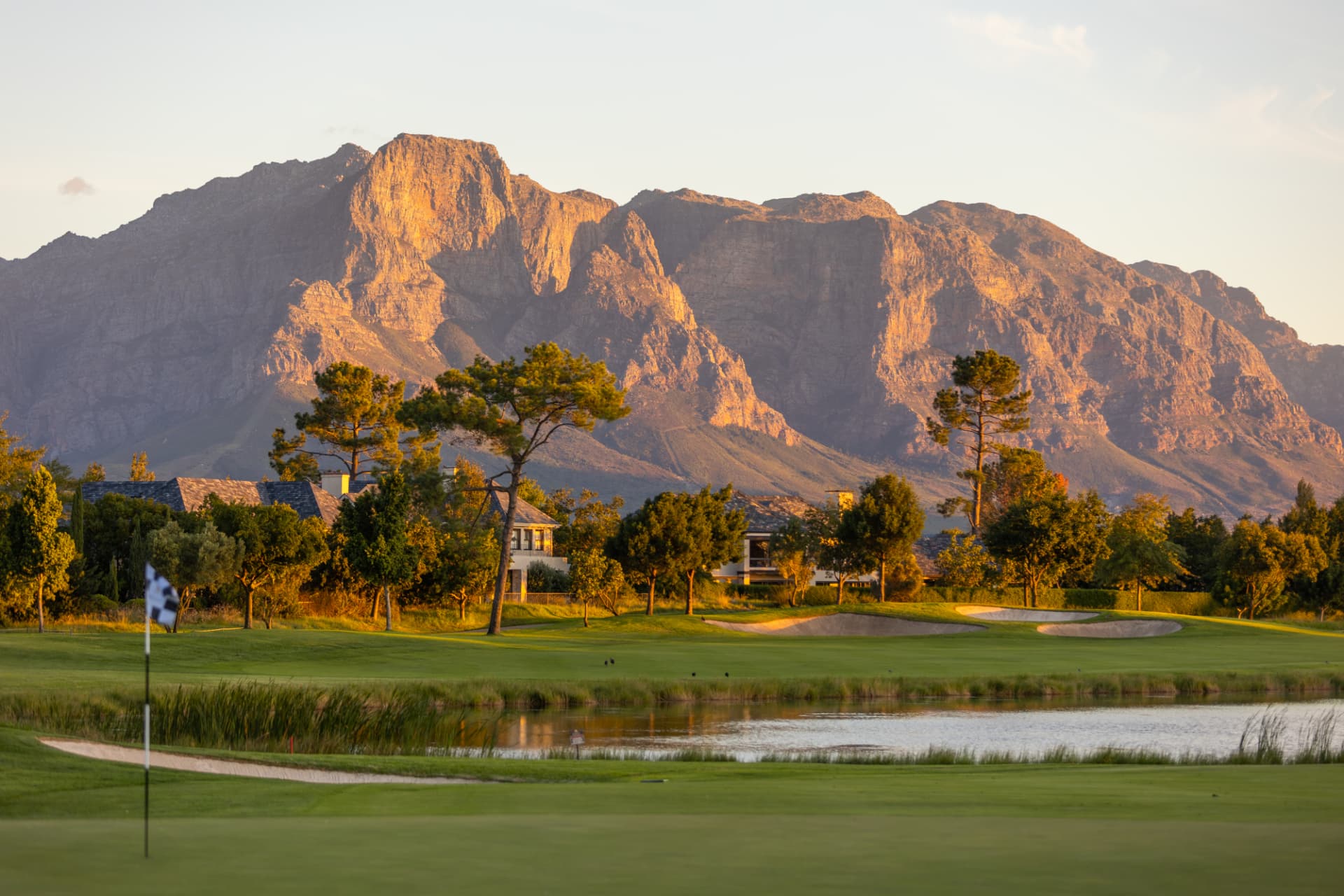 Green and water at Pearl Valley with the Franschhoek Valley mountains glowing in evening light