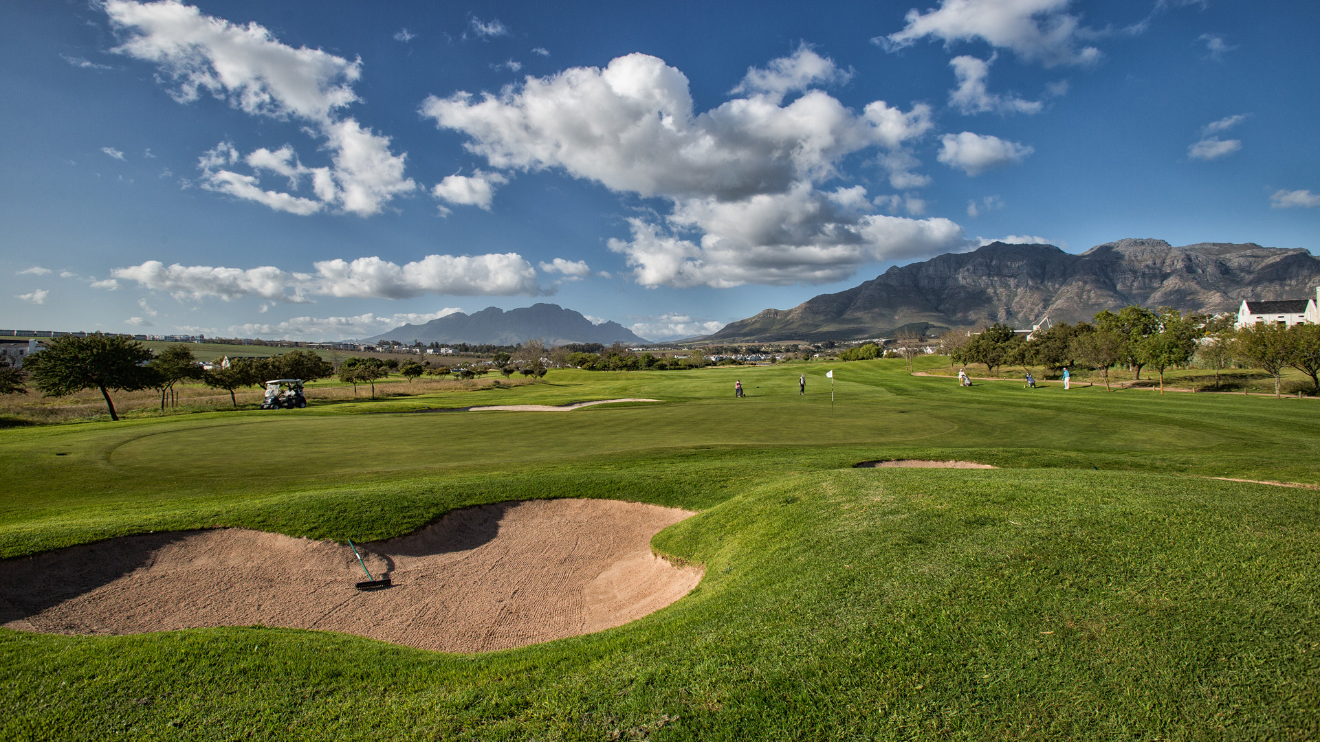 Bunkered green on the De Zalze course with the Stellenbosch mountains beyond