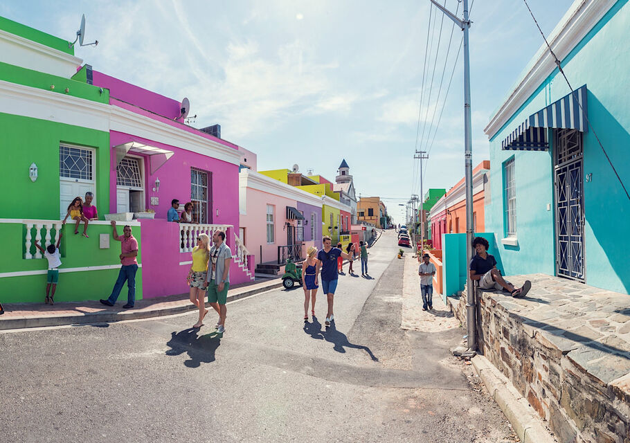 Brightly painted houses lining a sunlit street in Bo-Kaap, Cape Town